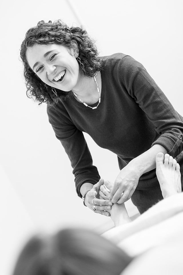 Louise Collyer working with a patient.